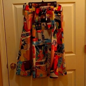 Magnificent bold print skirt with tie belt and pockets.